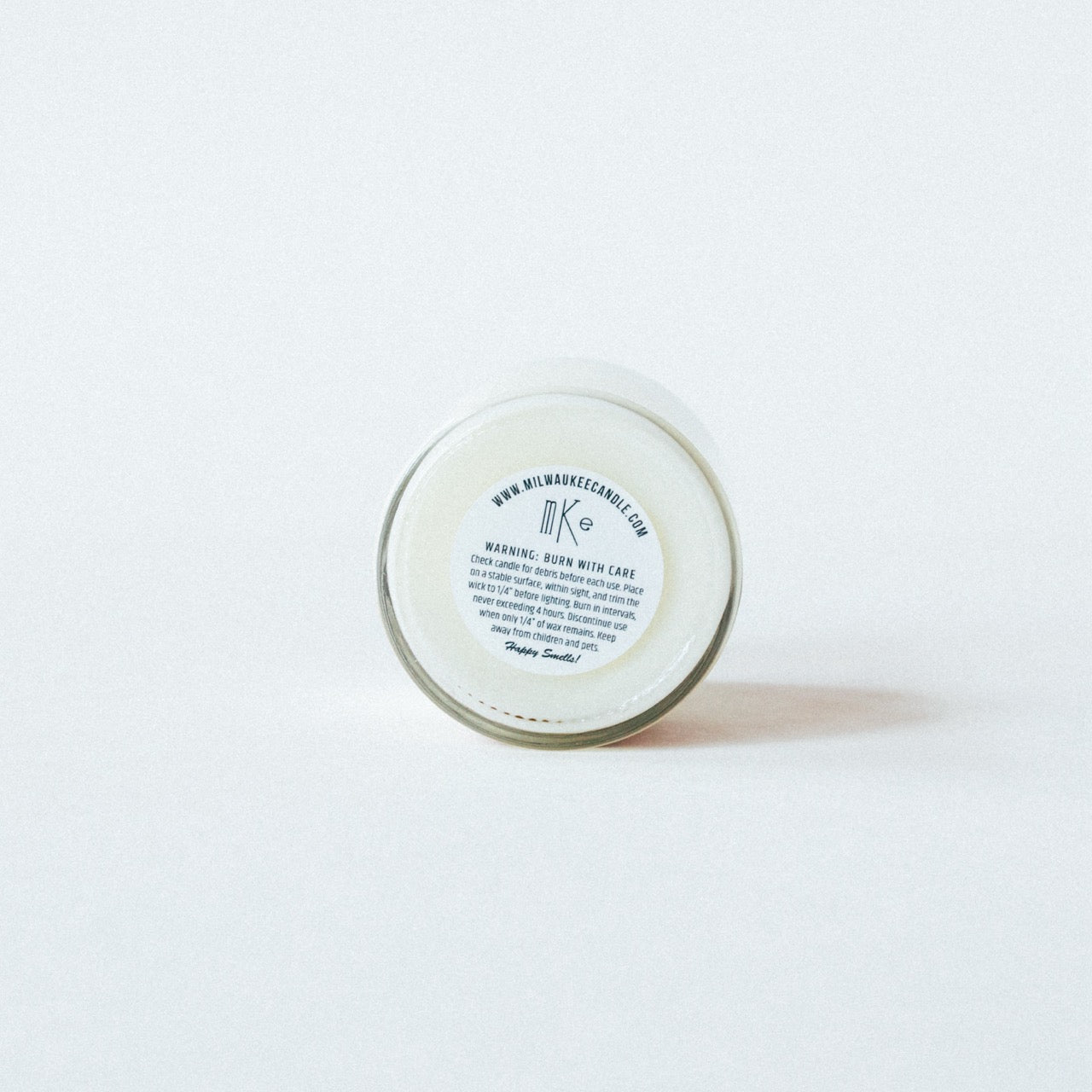 Custom warning label on a 6oz soy wax vanilla buttercream scented candle