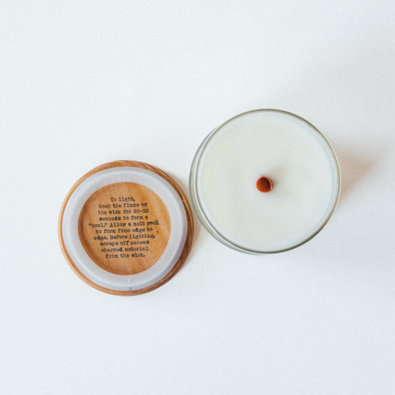 Stamped wooden lid showing proper wood wick burning instructions for Buttercream City Vanilla Candle.