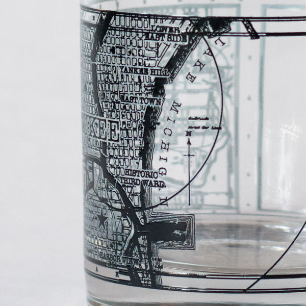 11oz whiskey rocks glass with a screen printed vintage map of Milwaukee. A Milwaukee Candle Co. and Glassnote Candle Bar collaboration. Side 2 close up.