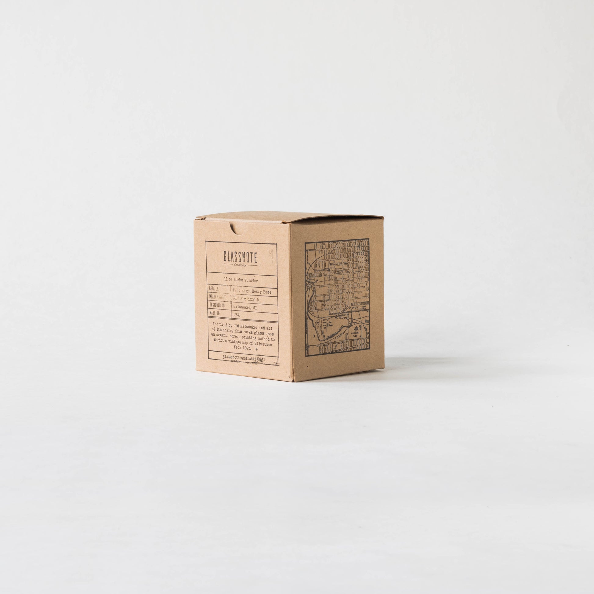 11oz whiskey rocks glass with a screen printed vintage map of Milwaukee. A Milwaukee Candle Co. and Glassnote Candle Bar collaboration. Back view of packaging (kraft box with Glassnote stamp on the back and map stamp on the side)