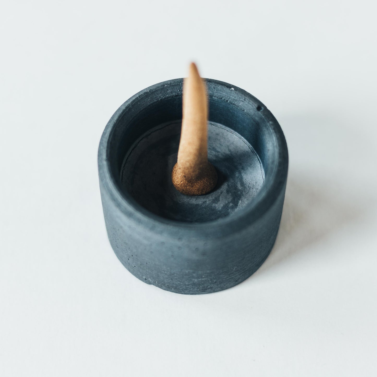 ZOUZ natural incense cup shaped concrete incense cone burner. Top view.