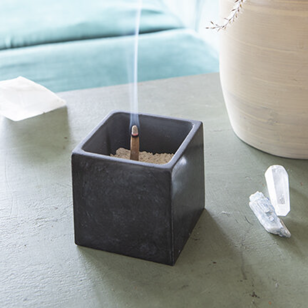 Dark gray ZOUZ natural incense cube shaped concrete incense cone burner. 