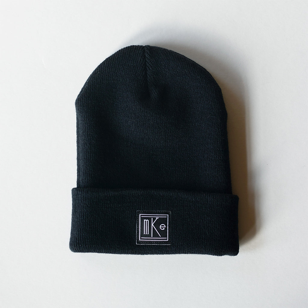 black knit beanie with black and white MKE patch