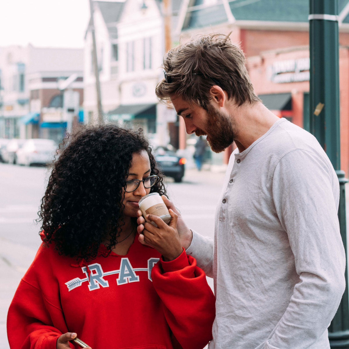Couple smelling candle on Brady Street, Milwaukee.