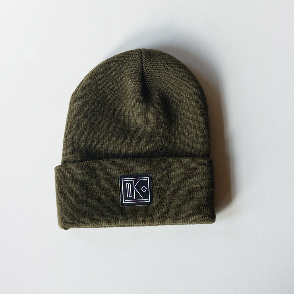olive green knit beanie with black and white MKE patch