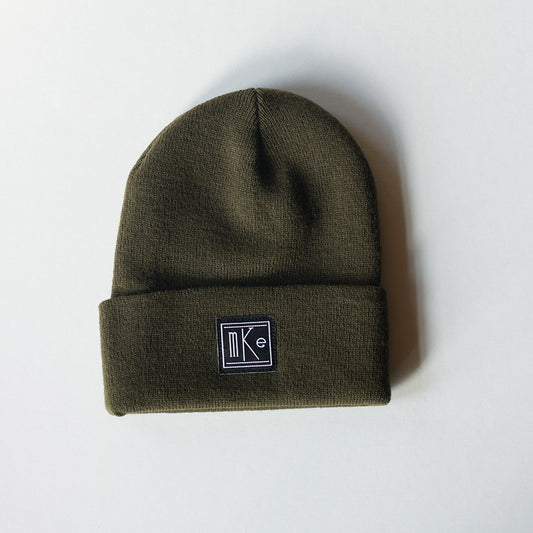 olive green knit beanie with black and white MKE patch