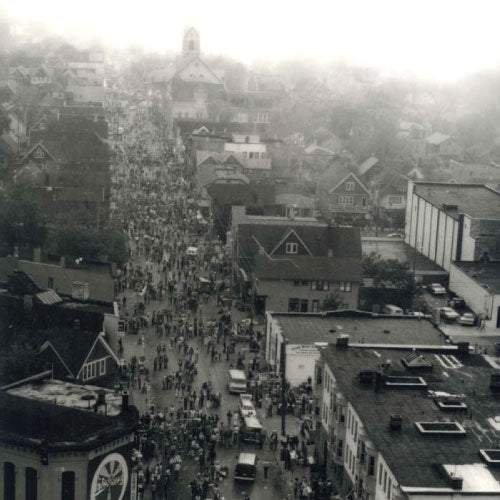 Old vintage black and white photo of Brady Street in Milwaukee, Wisconsin.