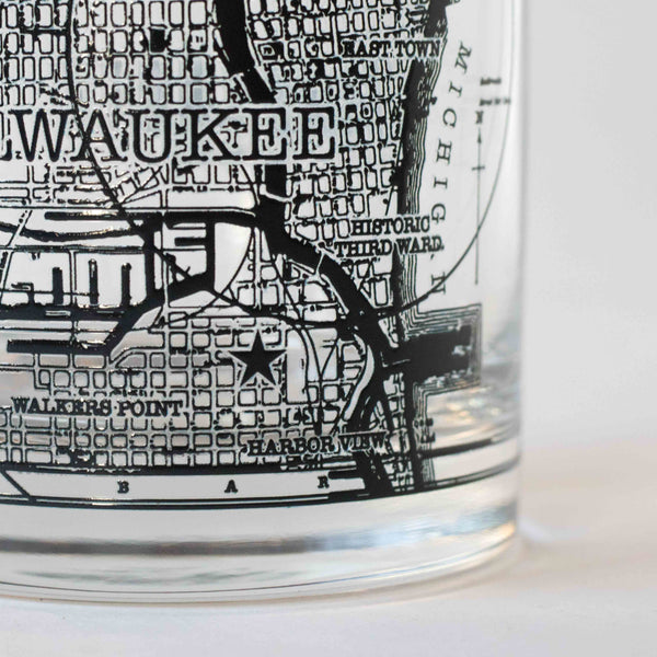 11oz whiskey rocks glass with a screen printed vintage map of Milwaukee. A Milwaukee Candle Co. and Glassnote Candle Bar collaboration. Side 3 close up.