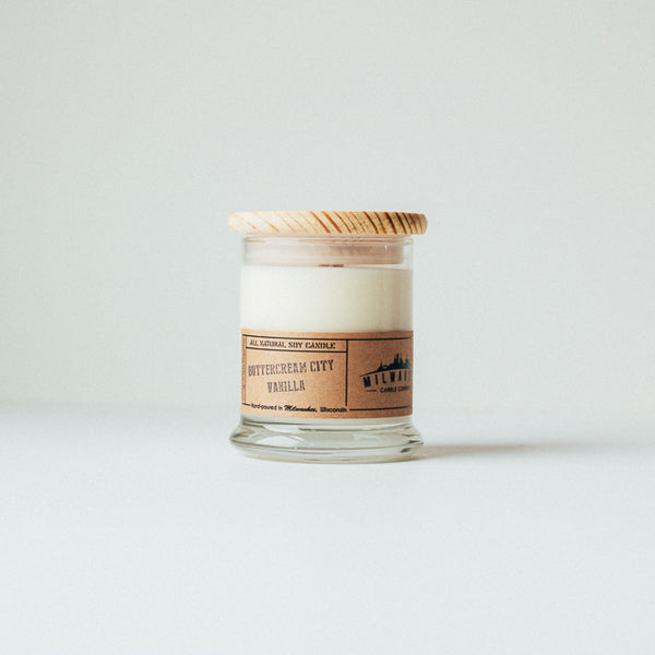 12 ounce ButterCream City Vanilla soy wax candle with wood wick, wood lid and kraft paper label. Hand-poured in Milwaukee, Wisconsin.