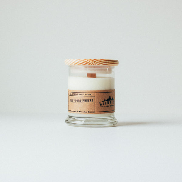12 ounce Lake Park Breeze soy wax candle with wood wick, wood lid and kraft paper label. Hand-poured in Milwaukee, Wisconsin.