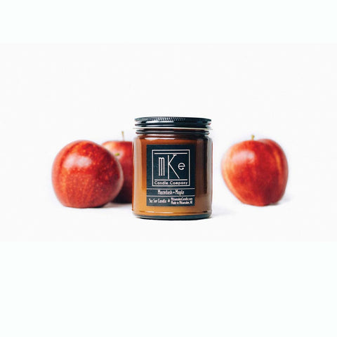 9 ounce Macintosh and Maple amber jar soy candle with apples in the background