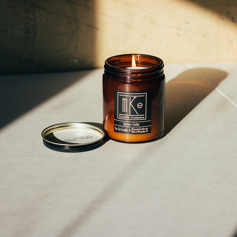 Lit 9 ounce amber jar soy candle