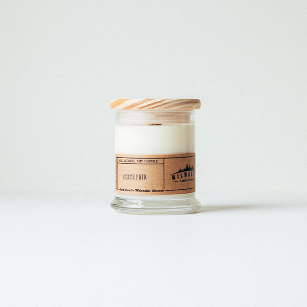 12 ounce State Fair soy wax candle with wood wick, wood lid and kraft paper label. Hand-poured in Milwaukee, Wisconsin.